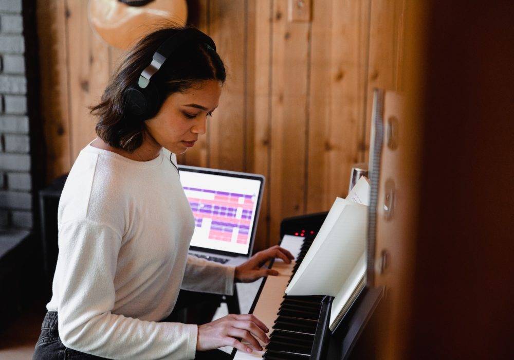 woman playing a musical keyboard