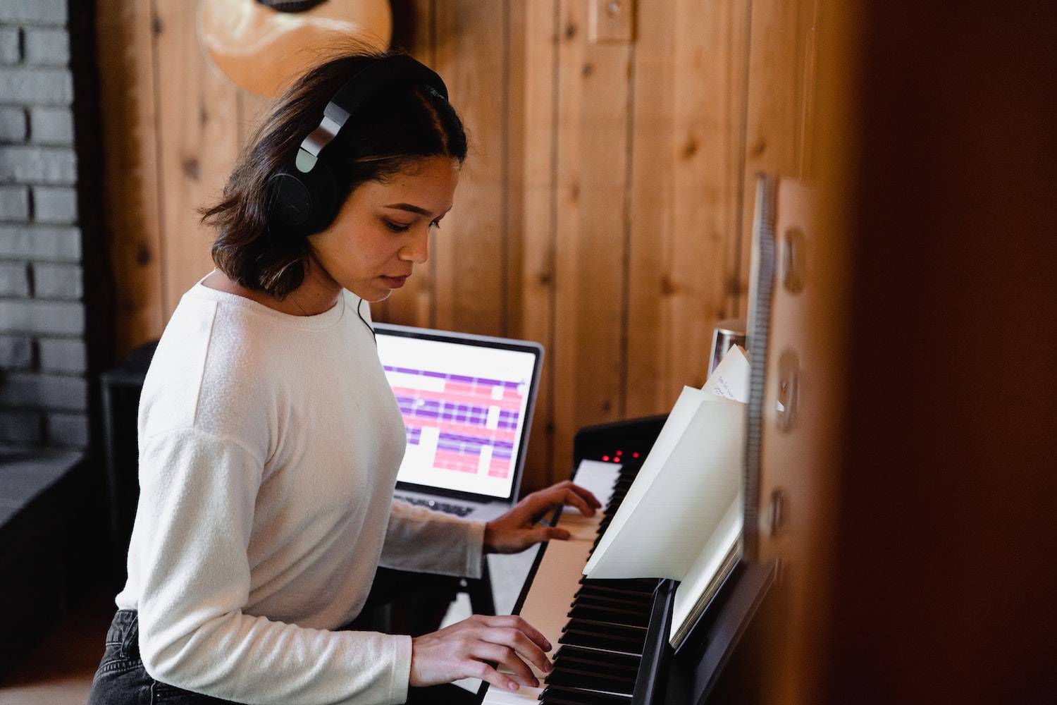 woman playing a musical keyboard