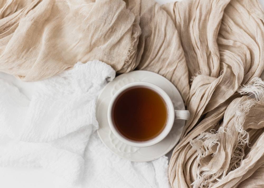 warm cup of tea with blankets