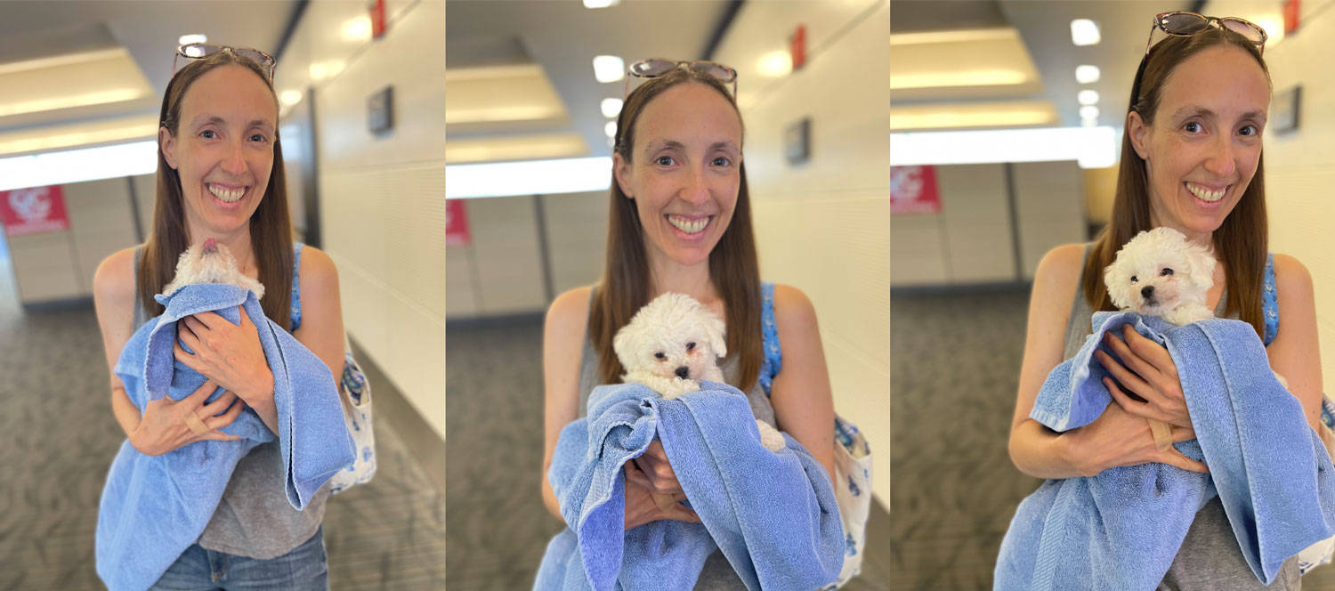 woman and puppy dog smiling