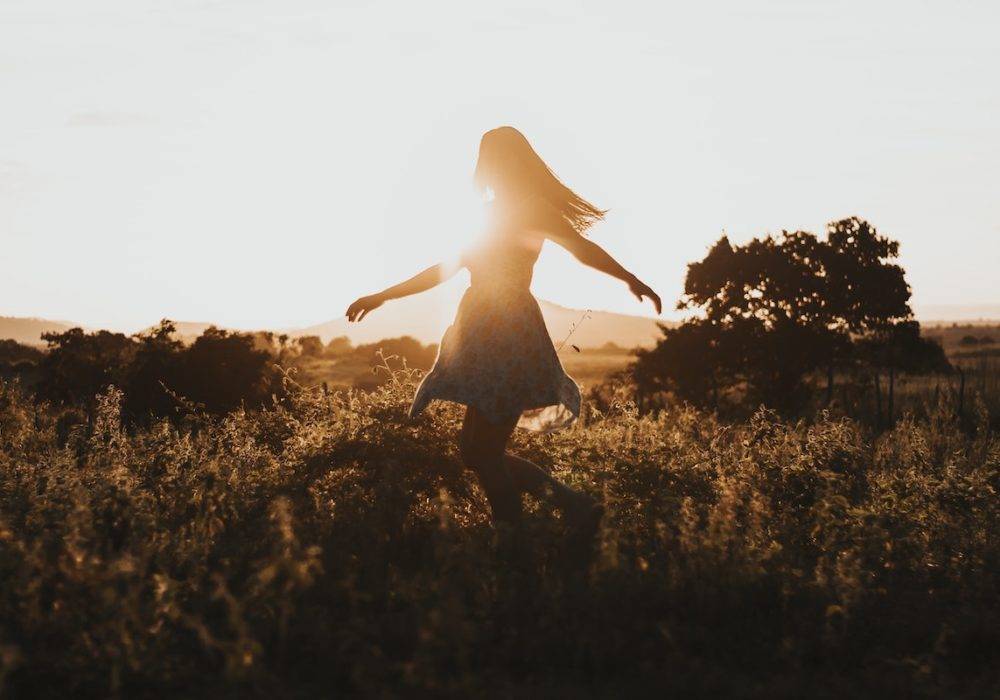 woman dancing freely in the open air