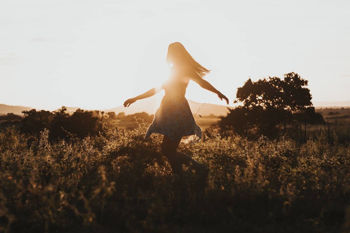 woman dancing freely in the open air