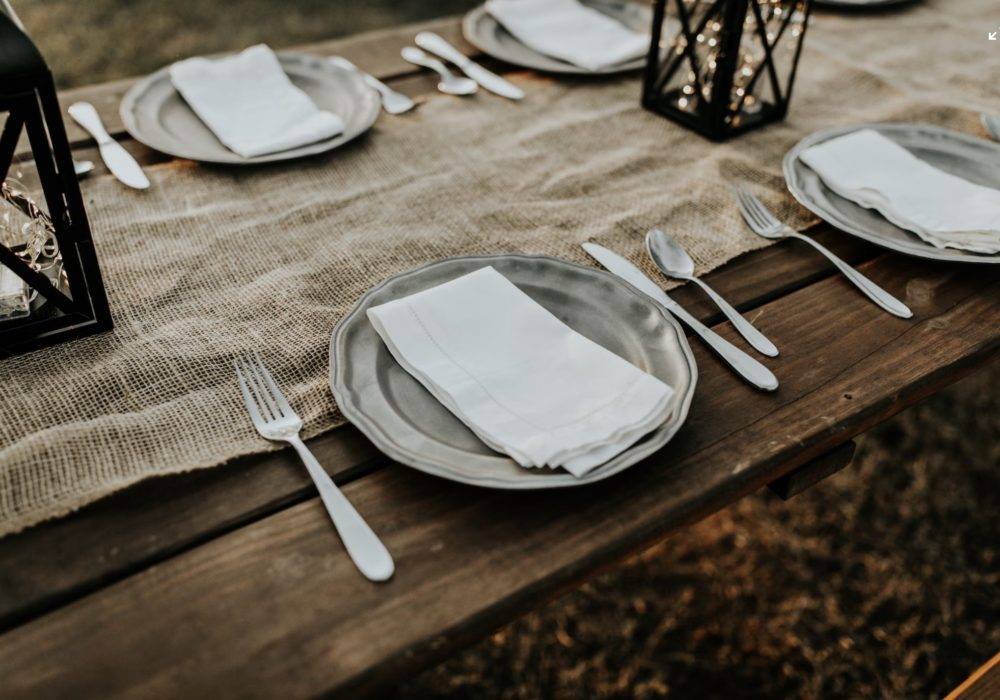 Plates and silverware before Thanksgiving dinner