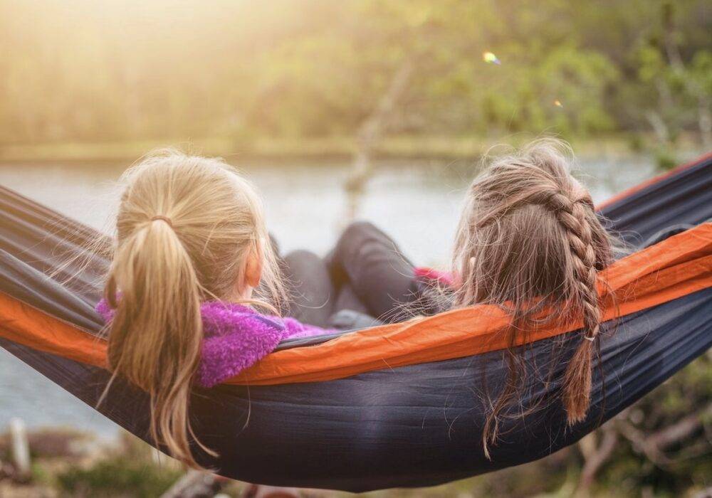 two girls relaxing in a hammock