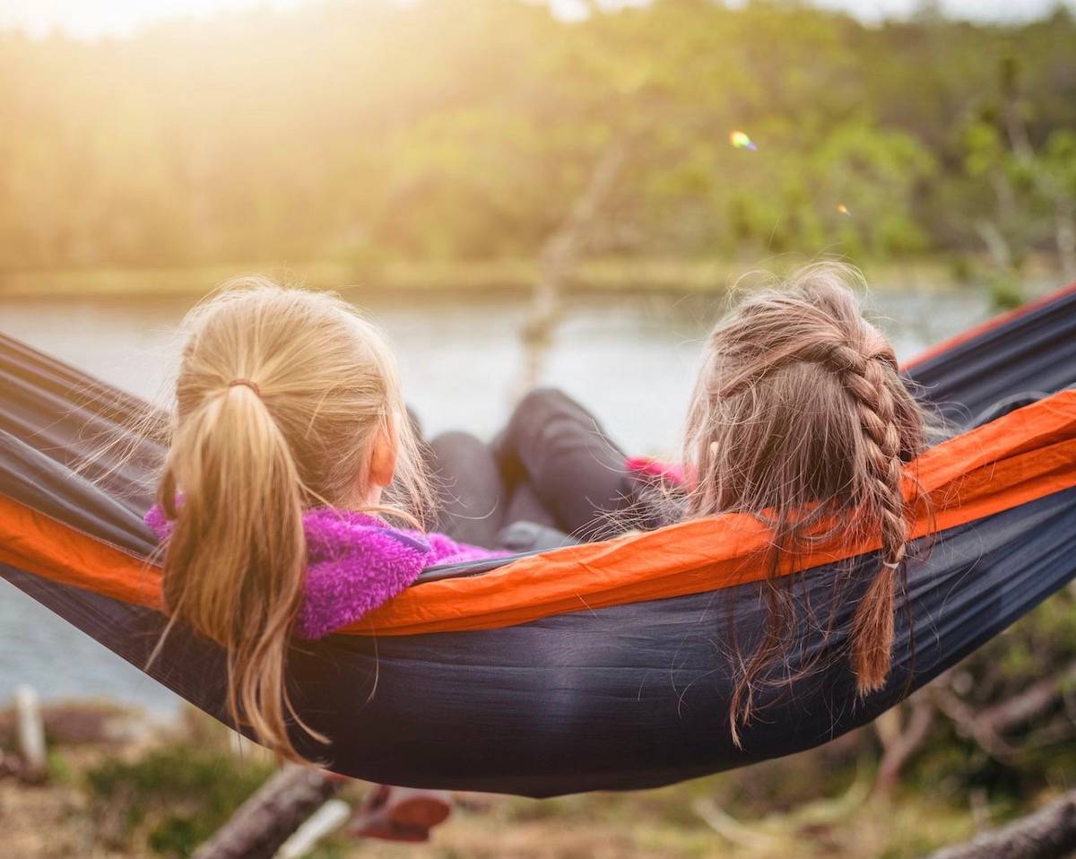 two girls relaxing in a hammock