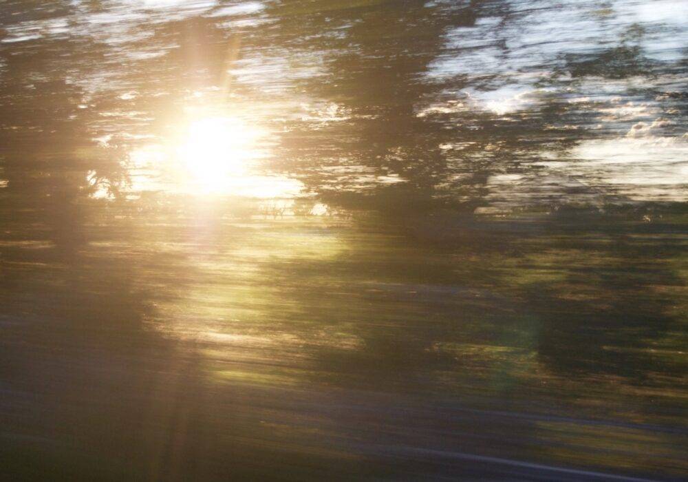 a car gaining more and more speed - the blurry view of movement out the window