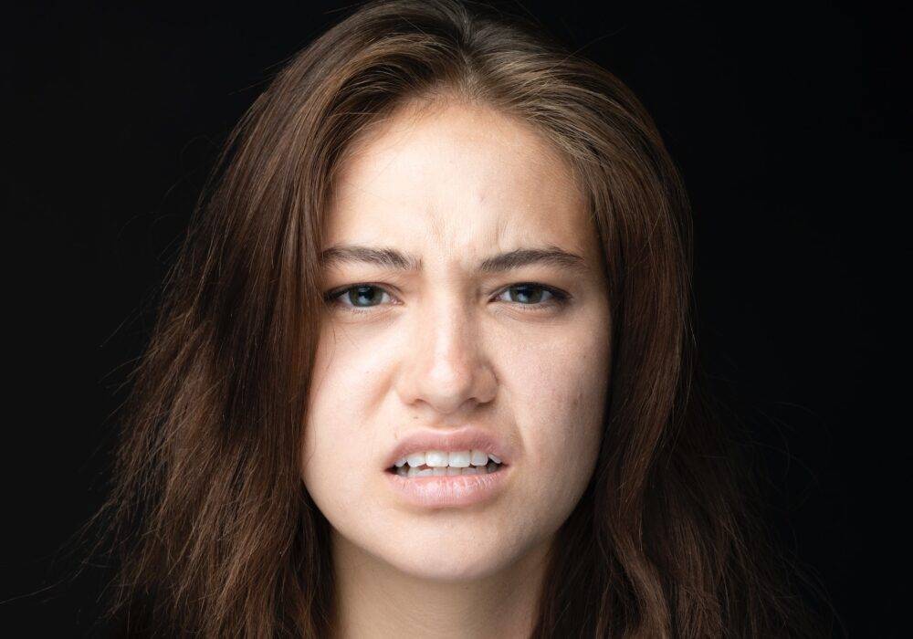 Woman's facial expression extremely displeased