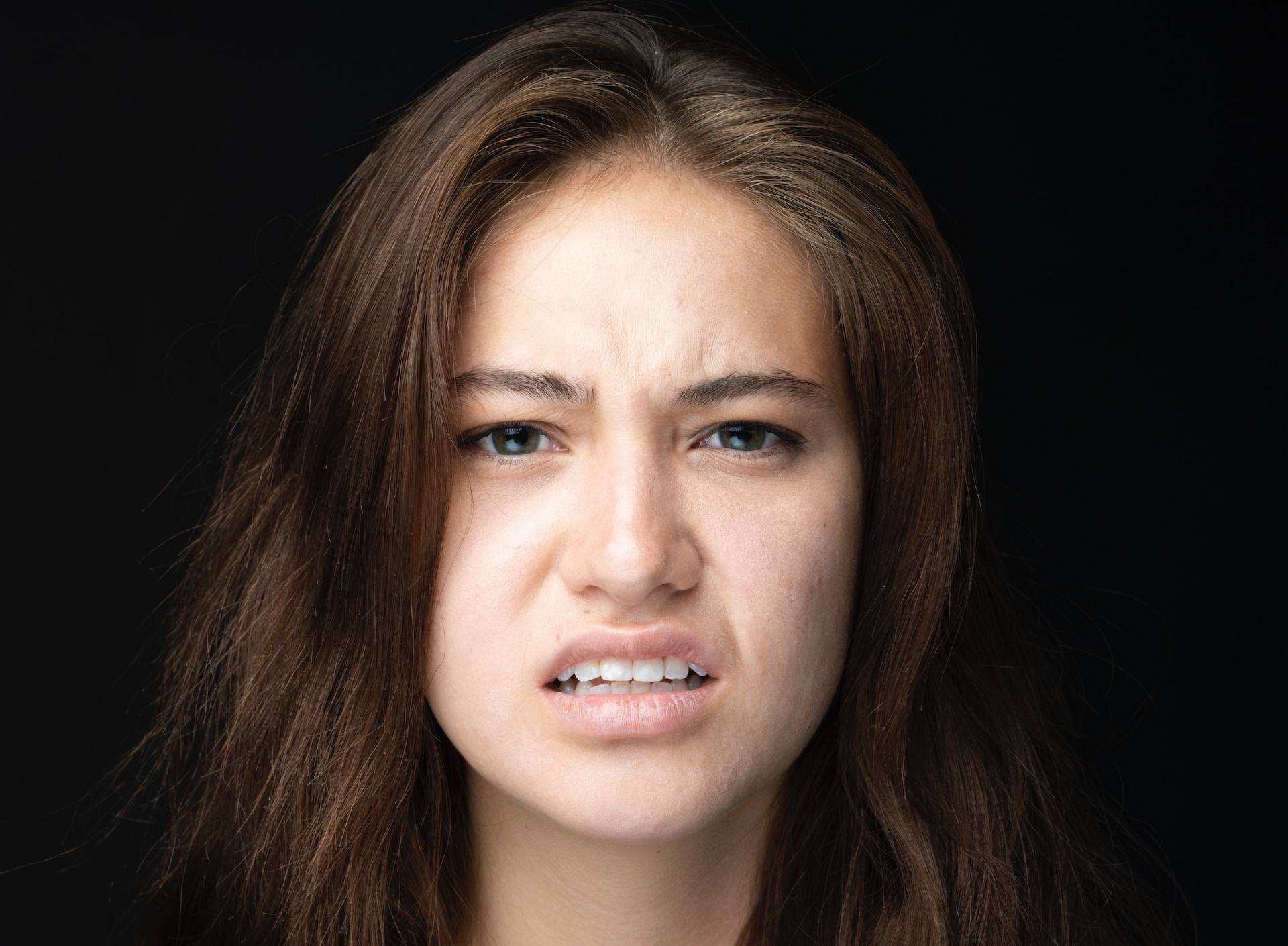 Woman's facial expression extremely displeased