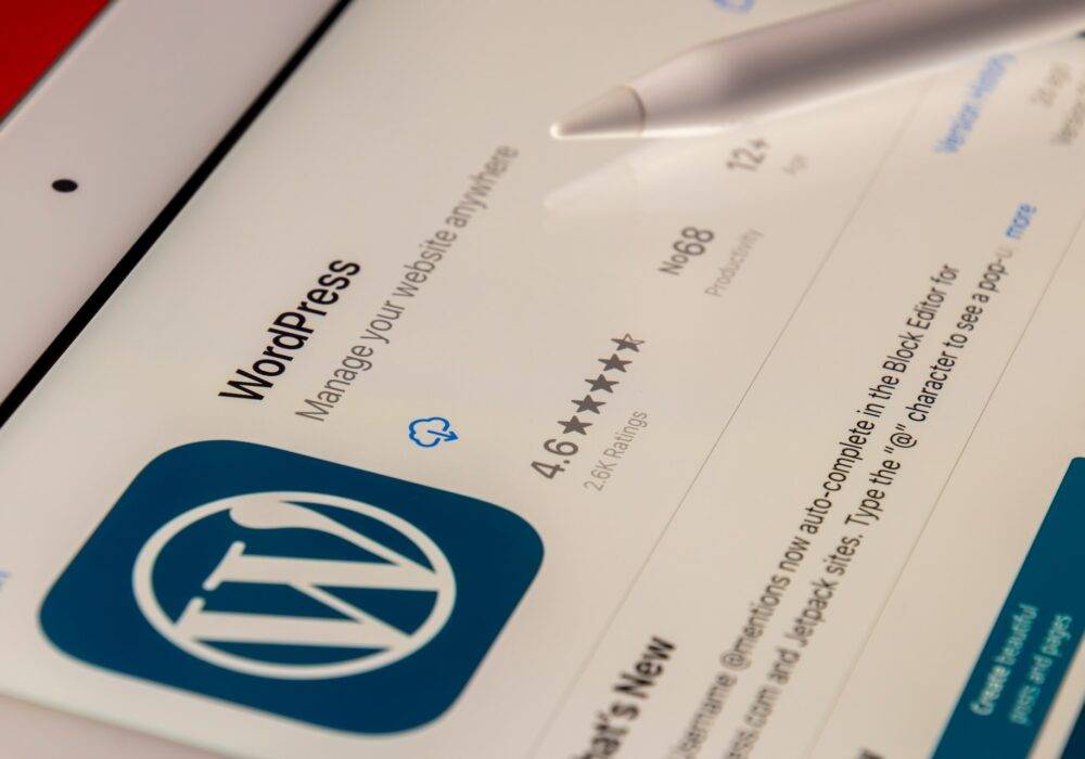 person downloading the WordPress mobile app from a tablet