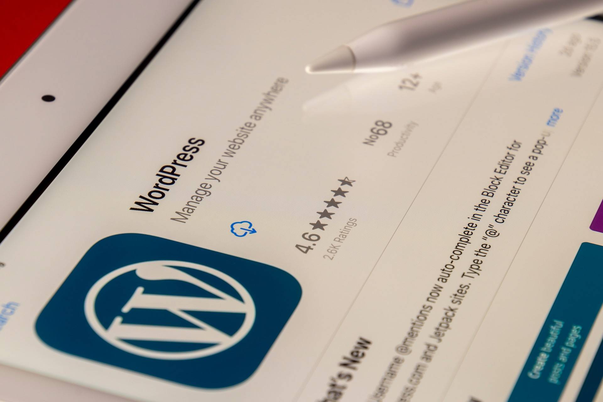 person downloading the WordPress mobile app from a tablet