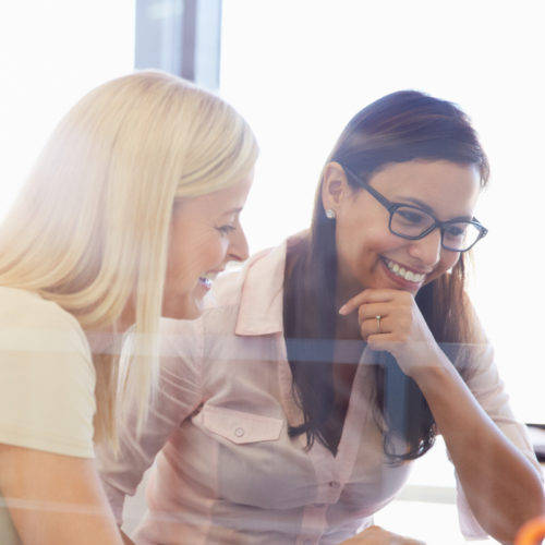 Women working together, office interior