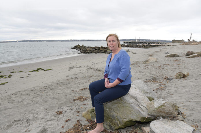 STRONG CONNECTIONS: Jennifer McCann, director of the U.S. Coastal Program at the University of Rhode Island’s Coastal Resources Center, shown here at the URI Bay Campus in Narragansett, says Rhode Island can build a sustainable future by connecting its related industries in the blue economy. / PBN PHOTO/MIKE SKORSKI STRONG CONNECTIONS: Jennifer McCann, director of the U.S. Coastal Program at the University of Rhode Island’s Coastal Resources Center, shown here at the URI Bay Campus in Narragansett, says Rhode Island can build a sustainable future by connecting its related industries in the blue economy. / PBN PHOTO/MIKE SKORSKI