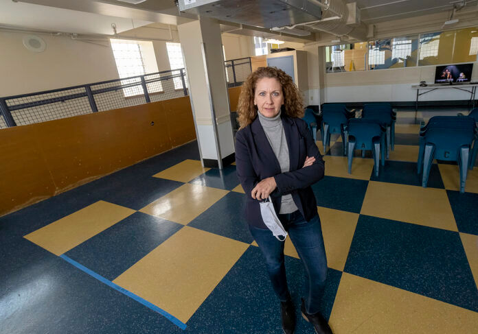 STANDING HER GROUND: Karen Santilli, director of Crossroads Rhode Island, is hopeful that an affordable-housing program included in Gov. Gina M. Raimondo’s initial budget proposal will survive despite the state’s new revenue woes. / PBN PHOTO/MICHAEL SALERNO STANDING HER GROUND: Karen Santilli, director of Crossroads Rhode Island, is hopeful that an affordable-housing program included in Gov. Gina M. Raimondo’s initial budget proposal will survive despite the state’s new revenue woes. / PBN PHOTO/MICHAEL SALERNO
