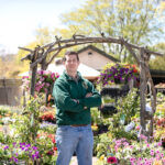 GROWING SALES: David Urban, owner of the Secret Garden, a small floral shop with a garden center in Jamestown, says he tripled sales since he purchased the business by expanding the list of local suppliers and stocking more. / PBN PHOTO/TRACY JENKINS  