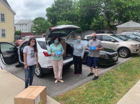 FROM LEFT, Allegra Scharff, health equity project manager at ONE Neighborhood Builders; Doris De Los Santos, City Council liaison; Marylee Dixon, City Council deputy chief of staff for operations; and City Council President Pro Tempore Michael Correia pick up 50,000 face masks to distribute to the Greater Providence community. / COURTESY PROVIDENCE CITY COUNCIL