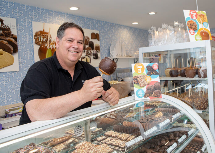 SWEET TREATS: Bill Hoffman owns two Kilwins locations on Thames Street in Newport. He opened a second location of the ice cream and candy store in May to expand the brand and capture foot traffic the first store was missing. / PBN PHOTO/KATE WHITNEY LUCEY SWEET TREATS: Bill Hoffman owns two Kilwins locations on Thames Street in Newport. He opened a second location of the ice cream and candy store in May to expand the brand and capture foot traffic the first store was missing. / PBN PHOTO/KATE WHITNEY LUCEY