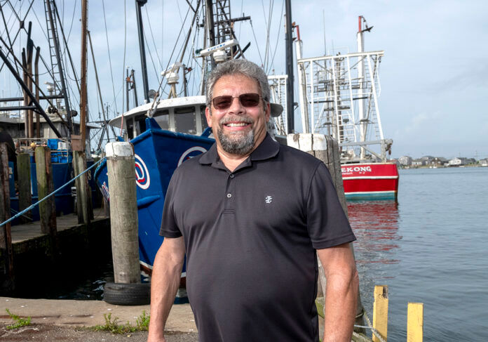 CAUTION SIGNAL: Fred Mattera, executive director of the Commercial Fisheries Center of Rhode Island, warns of the potential for loss of life and loss of vessels because the 1-mile-wide transit lanes allocated for traveling around wind turbines don’t provide enough room to safely maneuver vessels in high winds and storms when visibility is low. / PBN PHOTO/MICHAEL SALERNO CAUTION SIGNAL: Fred Mattera, executive director of the Commercial Fisheries Center of Rhode Island, warns of the potential for loss of life and loss of vessels because the 1-mile-wide transit lanes allocated for traveling around wind turbines don’t provide enough room to safely maneuver vessels in high winds and storms when visibility is low. / PBN PHOTO/MICHAEL SALERNO