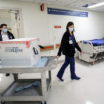 MODERNA INC Vaccine arrived at Rhode Island Hospital Dec. 22, which will also help prevent the spread of a new COVID-19 variant that was recently identified in the U.S. [Above] Richard Emery, Lifespan's pharmacy supervisor and Karen Nolan, Lifespan's pharmacy manager. / LIFESPAN CORP./ BILL MURPHY