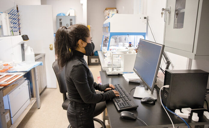 PHARMACIST ASSIST: Jeanine Sinanan-Singh, co-founder and CEO of Vitae Industries Inc. in Providence, says the company’s AutoCompounder, which allows pharmacists to mix ingredients to create the proper dose of medication for an individual patient, was the first product of its kind to market. / PBN PHOTO/TRACY JENKINS PHARMACIST ASSIST: Jeanine Sinanan-Singh, co-founder and CEO of Vitae Industries Inc. in Providence, says the company’s AutoCompounder, which allows pharmacists to mix ingredients to create the proper dose of medication for an individual patient, was the first product of its kind to market. / PBN PHOTO/TRACY JENKINS