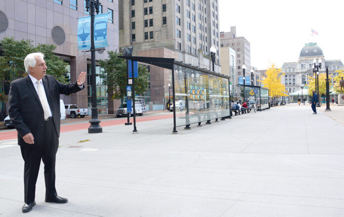 1023transitEG10 PETER ALVITI JR., director of the R.I. Department of Transportation, stands in Kennedy Plaza in Providence last year and explains where new bus stops are planned as part of RIDOT’s planned Providence Multi-Hub Bus System. / PBN FILE PHOTO/ELIZABETH GRAHAM