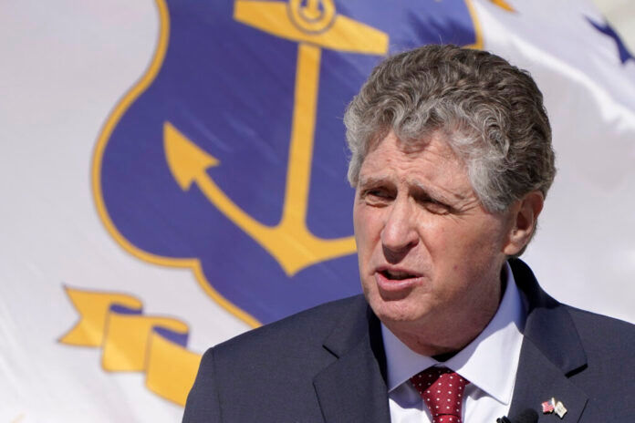 GOV. DANIEL J. MCKEE on Tuesday said he intends to sign the Act on Climate Change bill. / AP PHOTO/STEVEN SENNE
