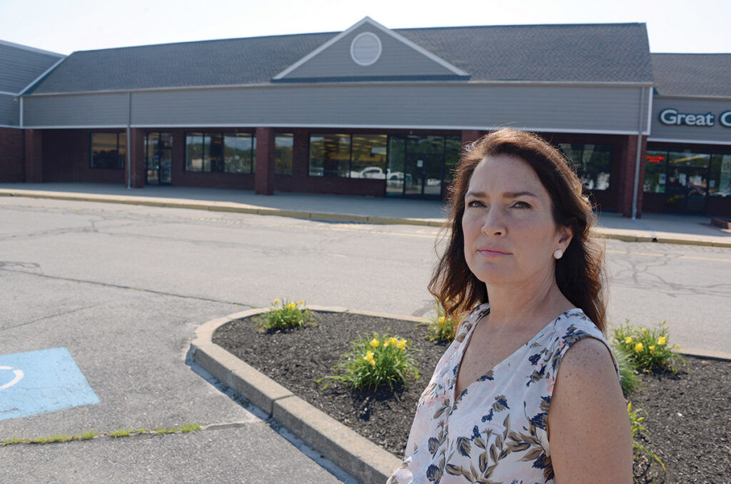 EMPTY ­FEELING: Heather Wall outside the former location of her business, Kidzone LLC, in North Kingstown. The company closed four months into the COVID-19 pandemic. / PBN PHOTO/ELIZABETH GRAHAM