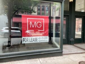 COMMERCIAL PROPERTIES ON WESTMINSTER and Weybosset streets in downtown Providence remained empty during the summer of 2021. Vacancies at several downtown properties have been prolonged and, in at least one case, prompted by the pandemic, as a result of work stoppages and shutdowns, according to several downtown real estate investors. This photo shows an empty storefront on Matthewson Street. PBN PHOTO/MARC LAROCQUE