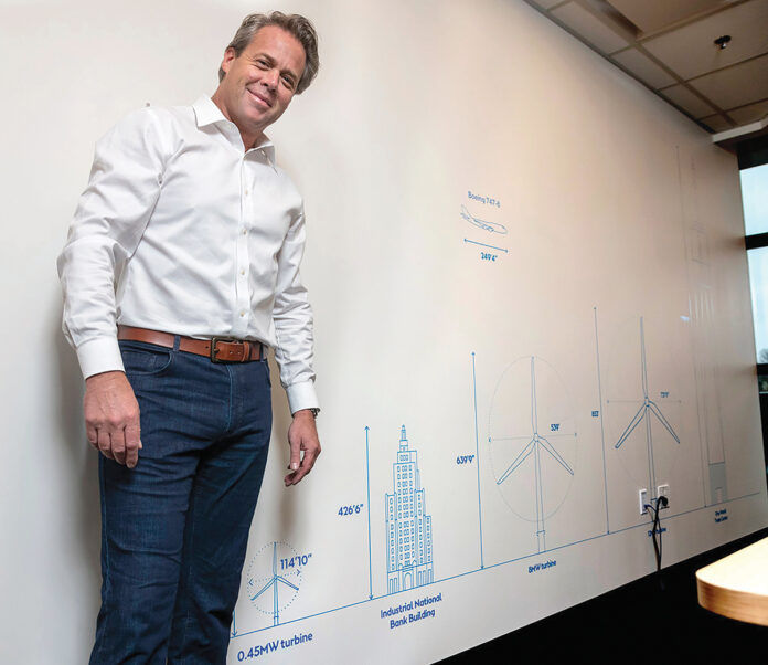 R.I. LARGE SCALE: Matthew Morrissey, head of Northeast markets for Orsted U.S. Offshore Wind Power, stands in the company’s office in Providence in March 2020. / PBN FILE PHOTO/MICHAEL SALERNO R.I. LARGE SCALE: Matthew Morrissey, head of Northeast markets for Orsted U.S. Offshore Wind Power, stands in the company’s office in Providence in March 2020. / PBN FILE PHOTO/MICHAEL SALERNO