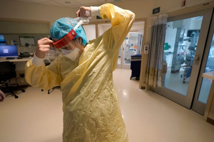 Nurse wearing mask (AP FILE PHOTO-STEVEN SENNE)