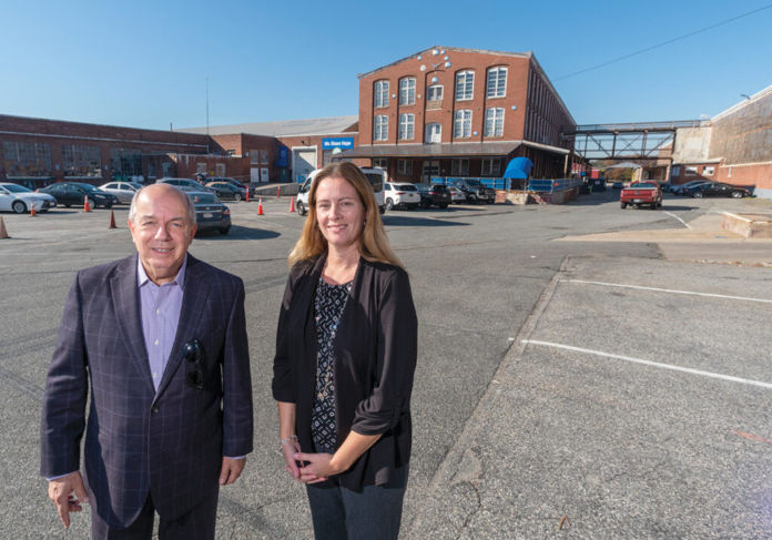 THE PHILLIPSDALE LANDING INDUSTRIAL COMPLEX at 310 Bourne Ave. in East Providence recently sold for $8.3 million after being on the market for four months, according to MG Commercial President Mike Giutarri, left, who closed the deal alongside his firm's vice president, Julie Freshman. / PBN FILE PHOTO/MICHAEL SALERNO THE PHILLIPSDALE LANDING INDUSTRIAL COMPLEX at 310 Bourne Ave. in East Providence recently sold for $8.3 million after being on the market for four months, according to MG Commercial President Mike Giutarri, left, who closed the deal alongside his firm's vice president, Julie Freshman. / PBN FILE PHOTO/MICHAEL SALERNO
