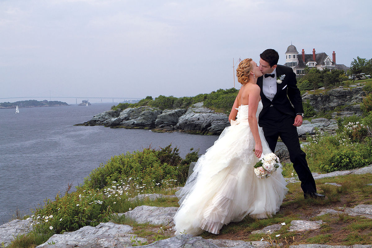 WEDDING MECCA: A renowned culinary scene along with mansions and beaches have helped Rhode ­Island become a wedding-destination mecca. Pictured, Christen and Peter Amenta celebrate their marriage at the Castle Hill Inn & Resort in Newport on June 16, 2013.  / PBN PHOTO/KATE WHITNEY LUCEY