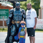 PEER HEROES: Manny DeBrito, right, formed A’s be4 to train mentors to work with local youth. He’s pictured with Raymond Ramos (Batman) and his 4-year-old son Theo DeBrito. / COURTESY JACKIE YOUNG/JACQUELYN CAROL CO.