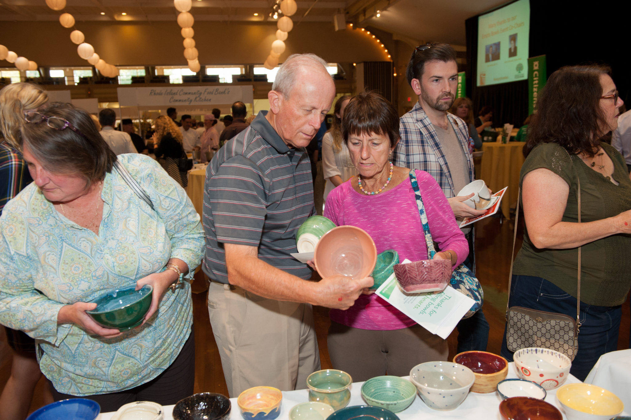ATTENDEES OF LAST YEAR'S Empty Bowls fundraiser choose their keepsake bowl. The annual event by the Rhode Island Community Food Bank is scheduled for Oct. 13 this year. / COURTESY RHODE ISLAND COMMUNITY FOOD BANK
