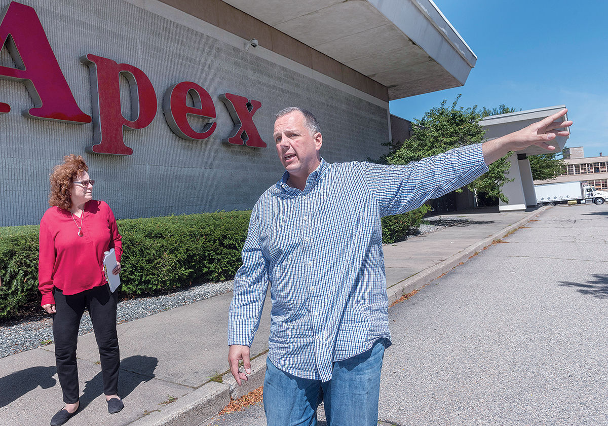 PROPOSED SITE: The Apex Department Store building in Pawtucket, the proposed location of a new PawSox ballpark, can be seen in the background during a walking tour of the city’s downtown area with Mayor Donald R. Grebien and Commerce Director Jeanne Boyle. / PBN PHOTO/MICHAEL SALERNO PROPOSED SITE: The Apex Department Store building in Pawtucket, the proposed location of a new PawSox ballpark, can be seen in the background during a walking tour of the city’s downtown area with Mayor Donald R. Grebien and Commerce Director Jeanne Boyle. / PBN PHOTO/MICHAEL SALERNO