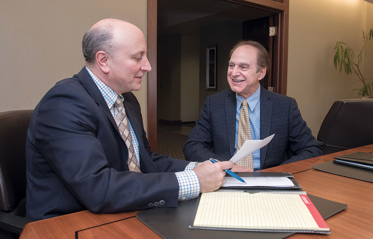 PARTNERS: From left, Emilio Colapietro of DiSanto, Priest & Co., and Steven Zaroogian, of Markarian & Meehan Ltd. The pair are managing partners of the two merging Rhode Island accounting firms. / PBN PHOTO/­MICHAEL SALERNO