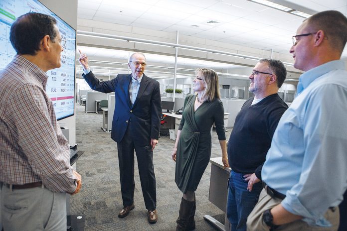 GROWTH INDUSTRY: Joseph O’Connell, vice president of business development at AstroNova, meets with company managers, part of routine walks through the offices. From left, Steve Holbrook, quality assurance manager; O’Connell; Jennifer Pray, marketing communications manager; Mike Natalizia, chief technology officer and vice president of technology partner alliances; and Josh Dumont, plant manager. / PBN PHOTO/RUPERT WHITELEY GROWTH INDUSTRY: Joseph O’Connell, vice president of business development at AstroNova, meets with company managers, part of routine walks through the offices. From left, Steve Holbrook, quality assurance manager; O’Connell; Jennifer Pray, marketing communications manager; Mike Natalizia, chief technology officer and vice president of technology partner alliances; and Josh Dumont, plant manager. / PBN PHOTO/RUPERT WHITELEY