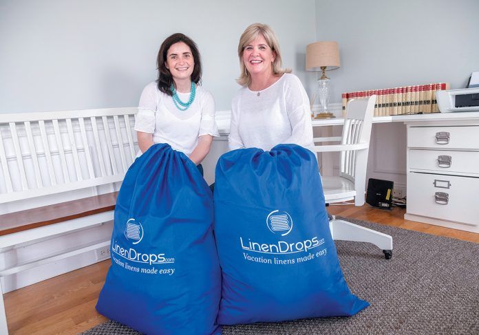 HEAVY LOAD: Rosa Ciunci, left, and Maureen Pagliaro, co-founders of LinenDrops.com, provide linen services for vacation and short-term rental properties throughout the region.
/ PBN PHOTO/MICHAEL SALERNO HEAVY LOAD: Rosa Ciunci, left, and Maureen Pagliaro, co-founders of LinenDrops.com, provide linen services for vacation and short-term rental properties throughout the region.
/ PBN PHOTO/MICHAEL SALERNO