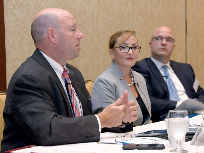 BEING PROACTIVE: Panelists at the 2018 PBN Cybersecurity Summit, held at the Crowne Plaza Providence-Warwick on Oct. 11, discuss ways companies can prepare for and prevent cyberattacks and hackers. From left: Jeffrey Ziplow, cybersecurity risk assessment partner for BlumShapiro; Francesca Spidalieri, senior fellow for cyber leadership at the Pell Center for International Relations and Public Policy at Salve Regina University; and Jason Farmer, senior solution manager for RiskSense.  / PBN PHOTO/MIKE SKORSKI