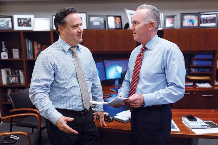 DEVOTED LEADER: Dr. Timothy J. Babineau, right, sees service as not just his profession but as a way of life he is passing along to his children, as it was passed on to him as a boy. Babineau speaks with David Levesque, media relations, Lifespan.
/ PBN PHOTO/RUPERT WHITELeY DEVOTED LEADER: Dr. Timothy J. Babineau, right, sees service as not just his profession but as a way of life he is passing along to his children, as it was passed on to him as a boy. Babineau speaks with David Levesque, media relations, Lifespan.
/ PBN PHOTO/RUPERT WHITELeY