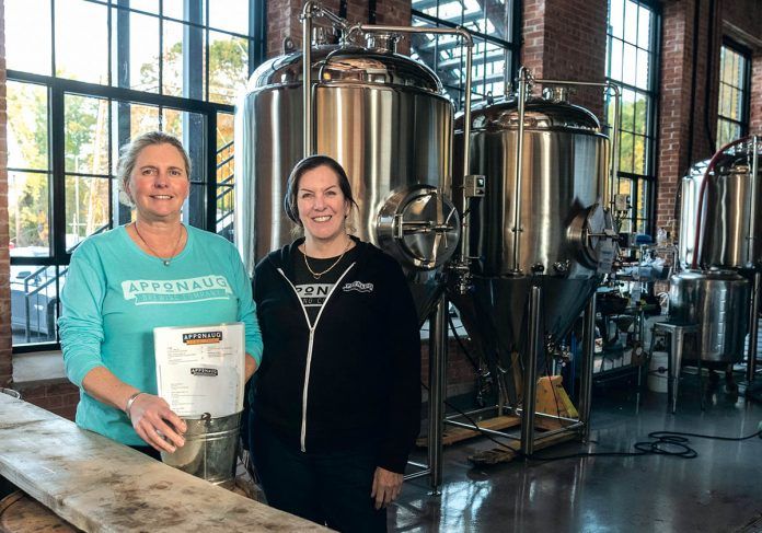 NEW PATH: Co-owners Kris Waugh, left, and Tamara McKenney worked in technical recruiting before opening Apponaug Brewing at the Pontiac Mills in Warwick. / PBN PHOTO/MICHAEL SALERNO NEW PATH: Co-owners Kris Waugh, left, and Tamara McKenney worked in technical recruiting before opening Apponaug Brewing at the Pontiac Mills in Warwick. / PBN PHOTO/MICHAEL SALERNO