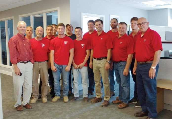 MATCH DAY: Members of the Pariseault Builders staff at the company headquarters in Warwick. 
 / COURTESY PARISEAULT BUILDERS MATCH DAY: Members of the Pariseault Builders staff at the company headquarters in Warwick. 
 / COURTESY PARISEAULT BUILDERS