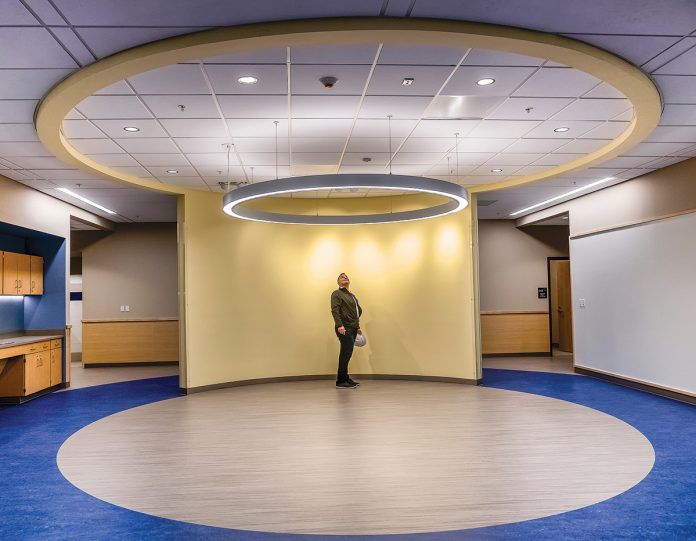 BREAKOUT SPACE: Barrington Middle School, now under construction, includes state-of-the-art classrooms and meeting spaces designed for collaborative learning. Brian Solywoda, a principal from architect Kaestle Boos Associates, stands in the breakout space with halo soffits.
 / PBN PHOTO/MICHAEL SALERNO BREAKOUT SPACE: Barrington Middle School, now under construction, includes state-of-the-art classrooms and meeting spaces designed for collaborative learning. Brian Solywoda, a principal from architect Kaestle Boos Associates, stands in the breakout space with halo soffits.
 / PBN PHOTO/MICHAEL SALERNO