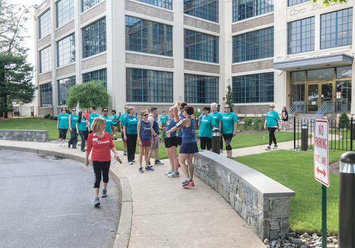ON-SITE FITNESS: Team Lifespan members participate in one of the company’s corporate fitness outings near the offices on Point Street in ÂProvidence. / PBN PHOTO/MICHAEL SALERNO ON-SITE FITNESS: Team Lifespan members participate in one of the company’s corporate fitness outings near the offices on Point Street in ÂProvidence. / PBN PHOTO/MICHAEL SALERNO