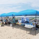 GREEN THE BEACH: Environmental-information displays are set up at Westerly Town Beach during last year’s inaugural Green the Beach event. This year’s event will be held at the beach on July 20.  / COURTESY TOWN OF WESTERLY
