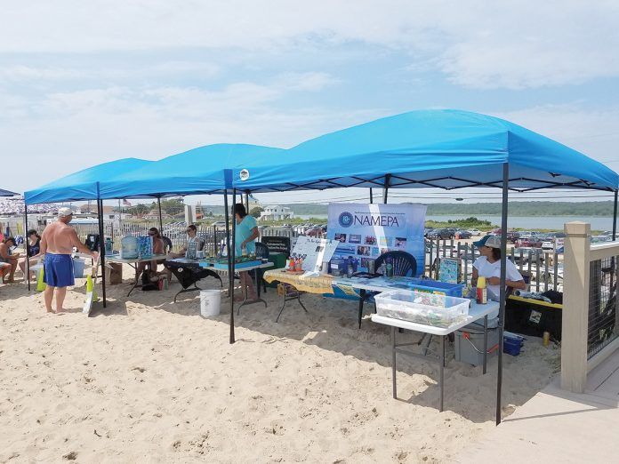 GREEN THE BEACH: Environmental-information displays are set up at Westerly Town Beach during last year’s inaugural Green the Beach event. This year’s event will be held at the beach on July 20.  / COURTESY TOWN OF WESTERLY