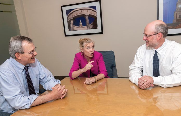 MANAGING PARTNERS: Cameron & Mittleman attorneys and managing partners, from left, Robert A. Migliaccio, Lynn E. ­Riley and Scott F. Bielecki converse at the Providence law firm. The firm has expanded practice areas as it added attorneys.    / PBN PHOTO/MICHAEL SALERNO