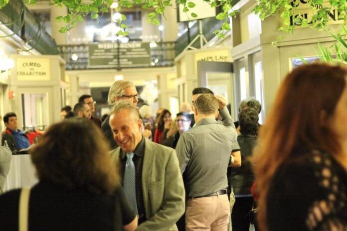 ATTENDEES MINGLE during a previous Project Weber/RENEW Celebrating CommUNITY event held at The Arcade in Providence. This year's event will take place Oct. 25 at Rooms & Works in Providence. / COURTESY PROJECT WEBER/RENEW