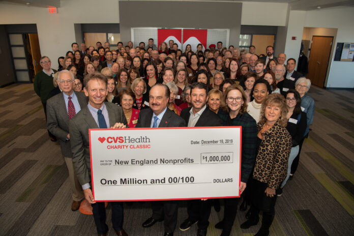 THE CVS HEALTH Charity Classic raised $1 million dollar for 86 nonprofits. In the foreground, from the left, event co-host Brad Faxon, CVS Health President and CEO Larry Merlo and event co-host Billy Andrade are joined by dozens of charitable partners whose organizations are the recipients of a $1 million dollar donation generated by the annual golf event. / COURTESY CVS HEALTH