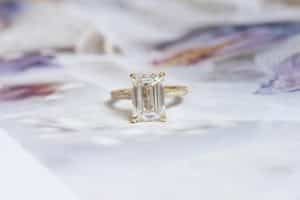 emerald cut yellow gold engagement ring