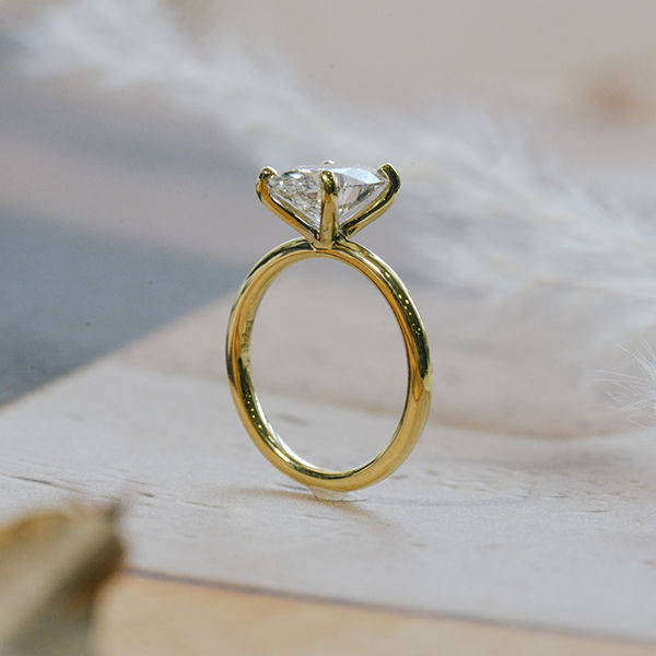 Oval Solitaire Engagement Ring With Round Prongs-side